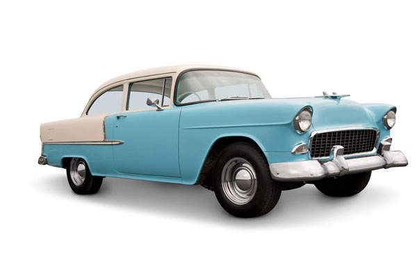Photo of a light blue classic car.