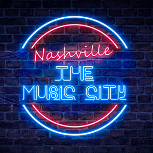 Circular red and blue neon sign on a dark brick wall saying Nashville is the Music City